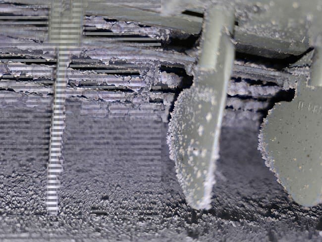 Close-up of dirty aircon filters showing dust and debris before professional air conditioner cleaning