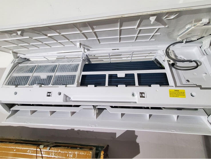 Cleaned filters and internal components of a split system unit showing energy-efficient results after servicing