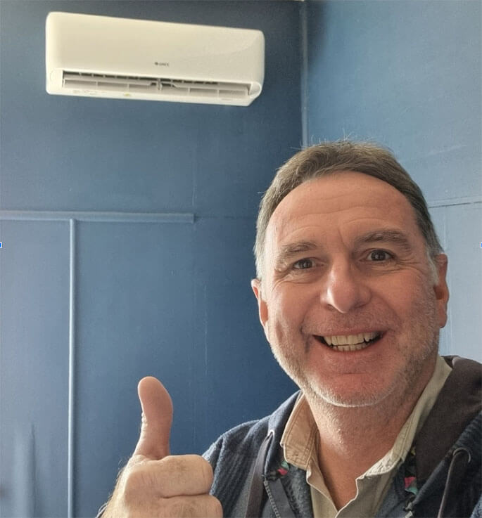 Paul Hayward from Hays Air Conditioning smiling with a thumbs up after completing professional aircon cleaning in Redcliffe home